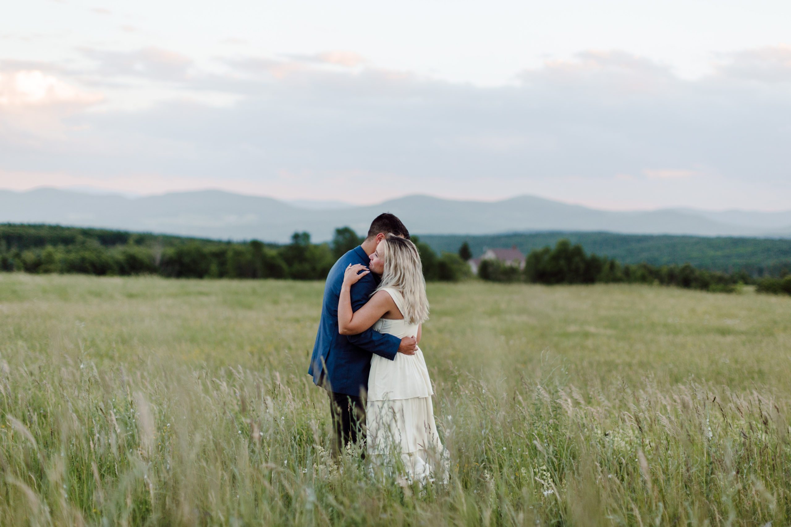 Romantic couple taking engagement photos by the mountains in Upstate New York